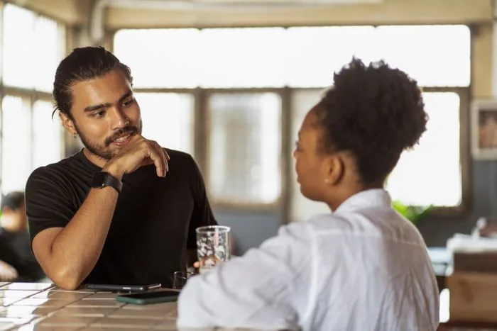 Two people in an open, friendly conversation